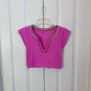 Urban Outfitters go for gold out from under top in pink